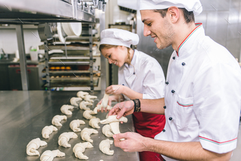Chef preparing sweet croissant in the pastry shop laboratory / Photodune, Misc