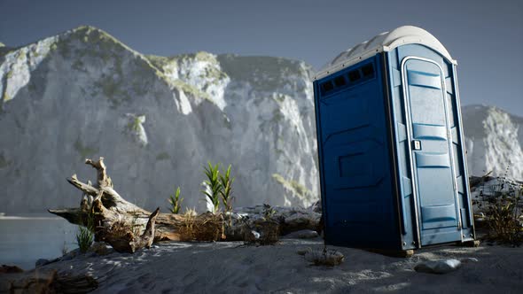 Portable Mobile Toilet in the Beach. Chemical WC Cabin