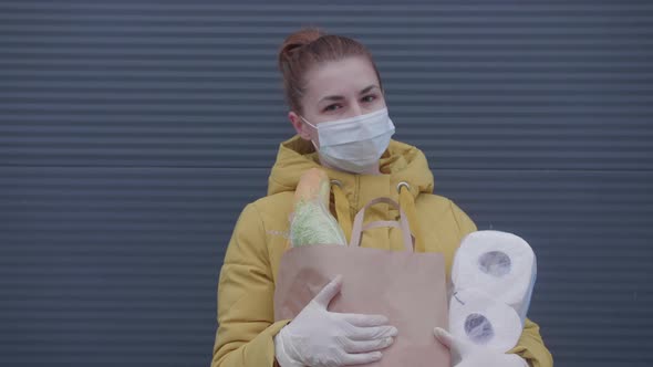 Young Woman with Purchases From the Supermarket