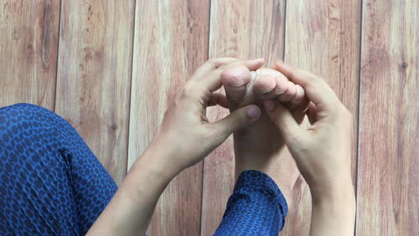 Women Feet and Hand Massage on Injury Spot. alt