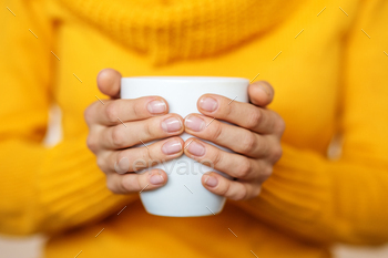 Cup of hot tea in your hands. Beverage concept, lifestyle, autum / Photodune, Misc