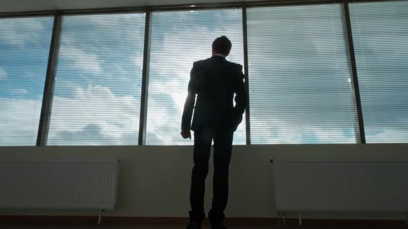 Business Motivation Young Businessman Stands in Front of a Panoramic Window Morning in a Modern