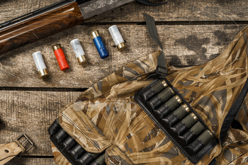 Various hunting equipment on old wooden background / Photodune, Misc