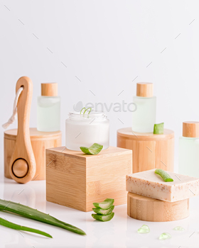Natural cosmetics with aloe vera on wooden podiums in reusable bottles / Photodune, Misc