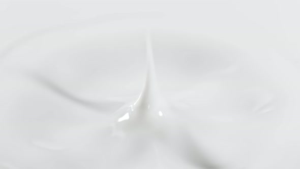 Super Slow Motion Detail Shot of Fresh Milk Drop at 1000 Fps