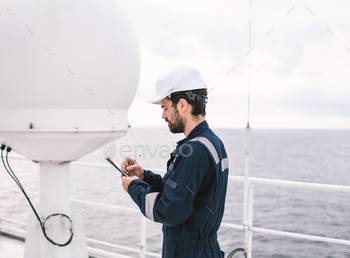 Service technician or serviceman near VSAT terminal / Photodune, Misc