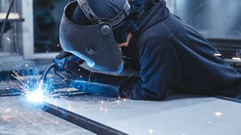 Welders On A Mission. Industrial labourer welding steel structure / Photodune, Misc