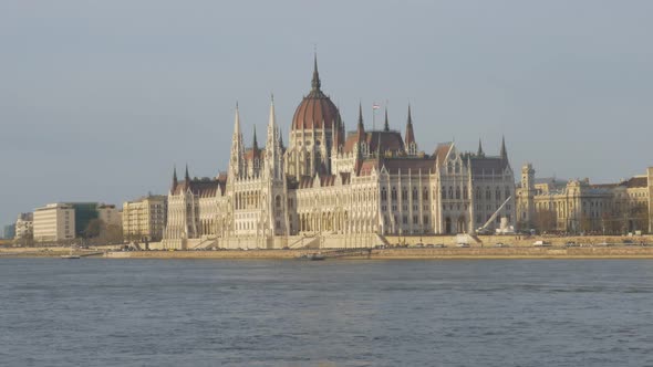 Parliament building of Hungary located on river Danube  and city of Budapest by the day 4K 2160p Ult