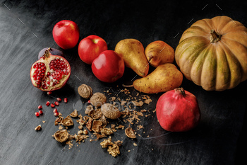still life with organic autumnal fruits and walnuts on wooden table / Photodune, Misc