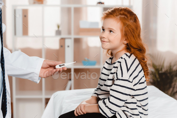 cropped shot of pediatrician giving thermometer to little smiling girl in clinic / Photodune, Misc
