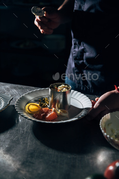 cropped shot of chef preparing salad with metal forming tube at restaurant / Photodune, Misc