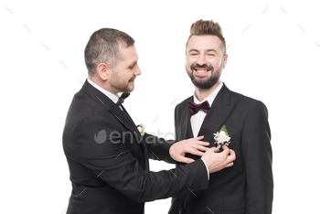 couple of grooms in tuxedos preparing to wedding day isolated on white / Photodune, Misc