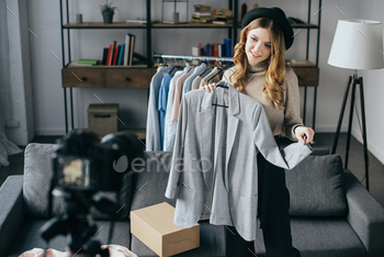smiling fashion blogger recording new vlog about jacket / Photodune, Misc