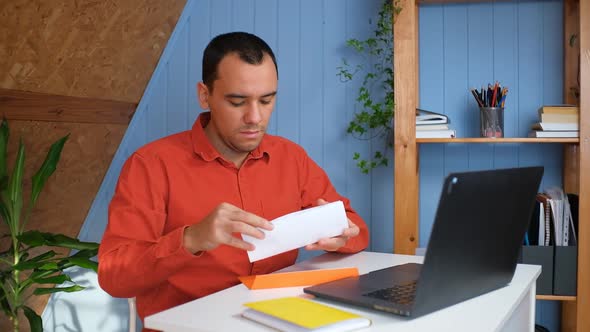 Excited Shocked Businessman Surprised with Information He See Sitting in Home Office