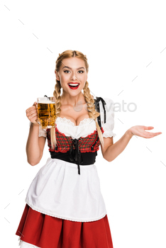 happy waitress in traditional german costume holding beer glass on Oktoberfest, isolated on white / Photodune, Misc
