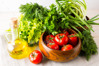 Olive oil, garlic and tomato in wooden bowl / Photodune, Misc