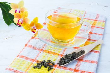Cup of tea on checkered napkin / Photodune, Misc