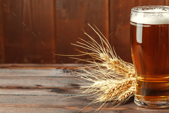 Glass beer on wood background. Creative photo / Photodune, Misc