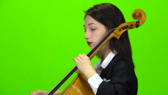 Musician Play Cello. Green Screen. Side View. Close Up