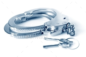 Metal handcuffs and keys isolated over white background / Photodune, Misc