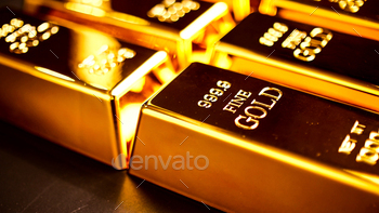 Many gold bullions brighting on the table. / Photodune, Misc