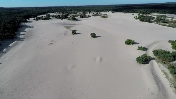 Long lasting aerial shot of a sand dune area.
