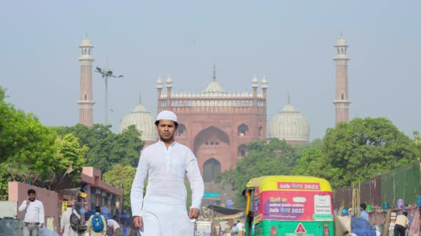 Muslim man walking in front of the Jama Masjid Delhi