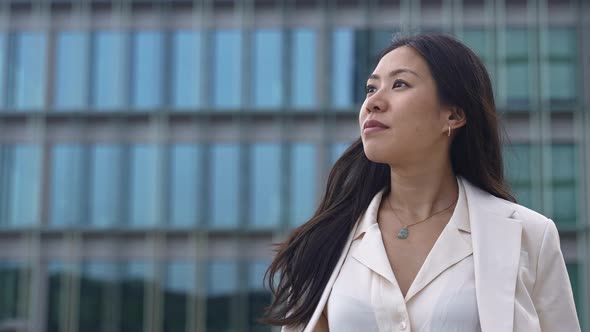 Young Asian Professional Woman Wearing Elegant Blazer Looking to the Side Inspired Female in