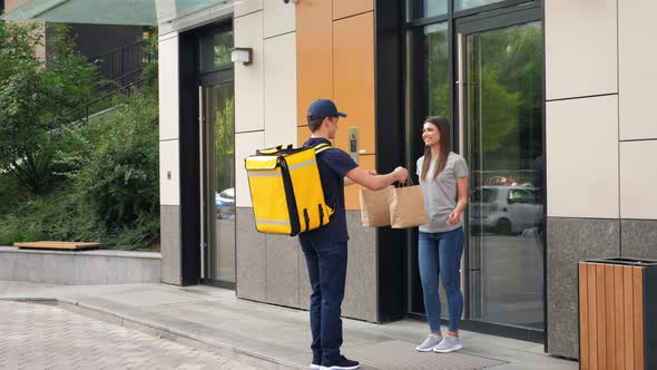 Positive Food Delivery Man Courier with Thermal Backpack Deliver Order Woman