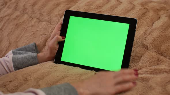 Adult Woman Working on Modern Tablet with Green Screen Mockup