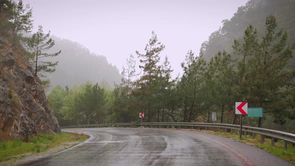 Empty mountain road at rainy day