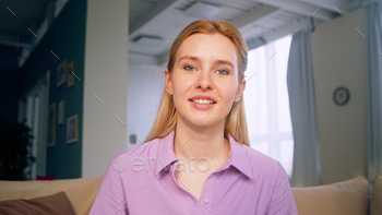Smiling girl talking to camera making conference video call / Photodune, Misc