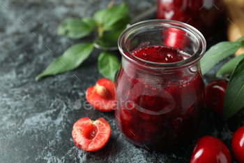 Cherry jam and ingredients on black smokey table / Photodune, Misc