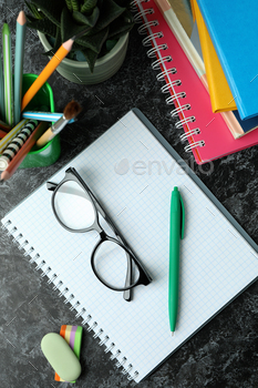 School or study supplies on black smokey table / Photodune, Misc