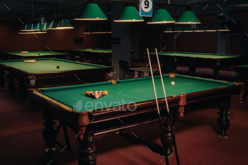 Billiard table with green surface and balls in the billiard club.Pool Game / Photodune, Misc
