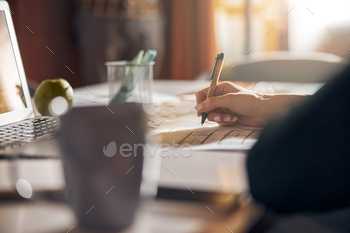 Experienced draftswoman modifying a building plan with a ball-point pen / Photodune, Misc