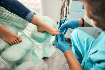 Female patient visiting podiatrist with pain on feet and toes / Photodune, Misc