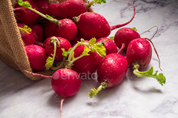 Red ripe radishes in a basket with grunge background / Photodune, Misc