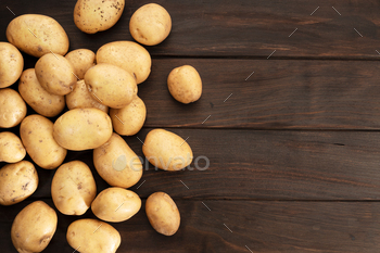 Group of New potatoes on wooden table / Photodune, Misc