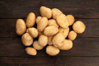 Group of New potatoes on wooden table / Photodune, Misc