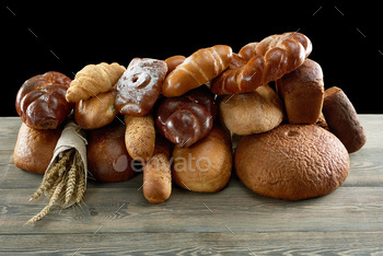 Assorted breads isolated on white / Photodune, Misc