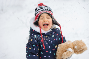 Child Playing in Snow / Photodune, Misc