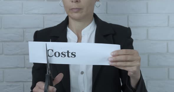 Businesswoman cut costs.