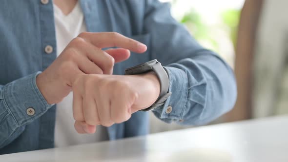 Hands of Man Using Smartwatch