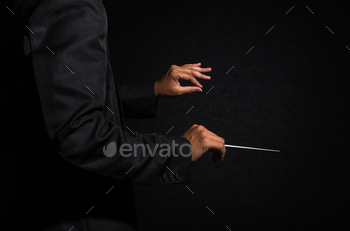 Orchestra conductor hands, Musician director holding stick on dark background / Photodune, Misc