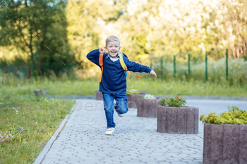 Happy child runs with a backpack to school. The concept of learning, school, mind, lifestyle and / Photodune, Misc