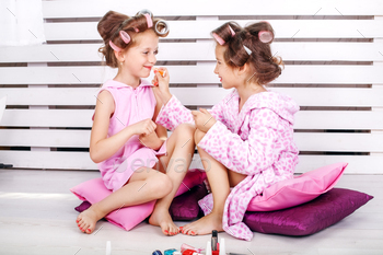 Two beautiful kids play cosmetics. Beauty salon. The concept is / Photodune, Misc