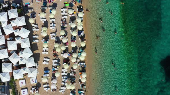 Aerial view on beach and umbrellas. Vacation and adventure. Beach and blue water.