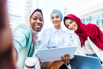 Beautiful muslim girl wearing hijab bonding outdoors / Photodune, Misc