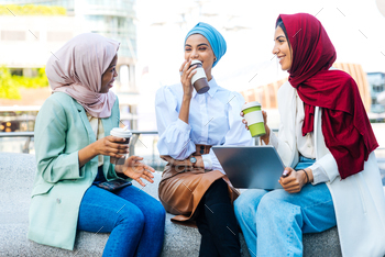 Beautiful muslim girl wearing hijab bonding outdoors / Photodune, Misc